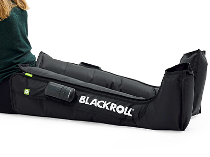 Person wearing Blackroll Recovery Boots
